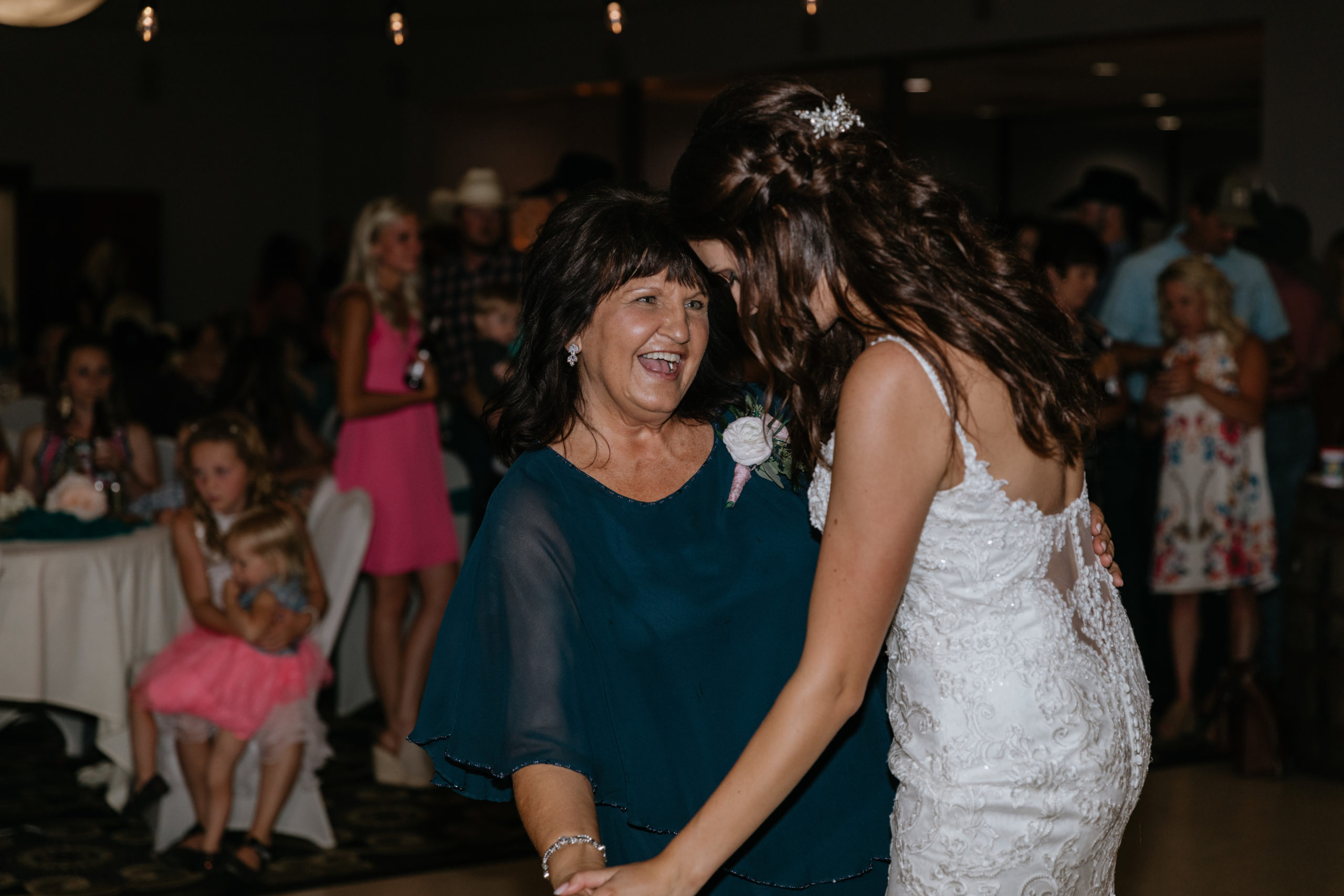 Heidi dances with her mom, smiling.