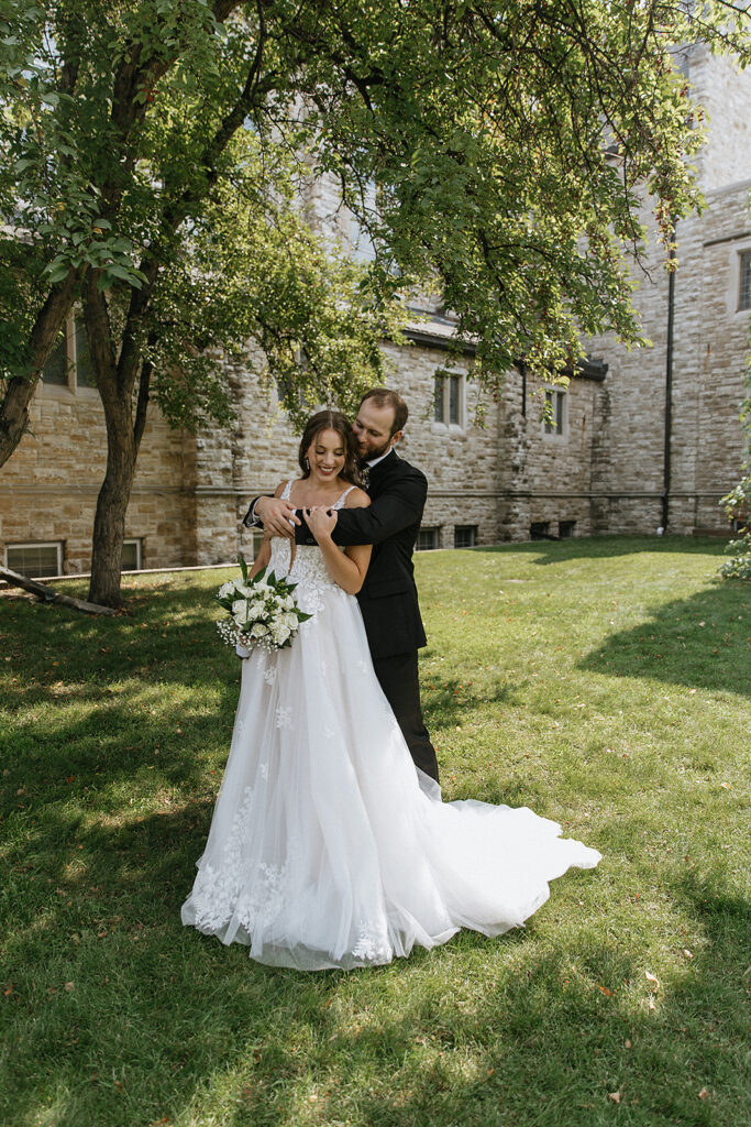 Picture of the bride and groom hugging