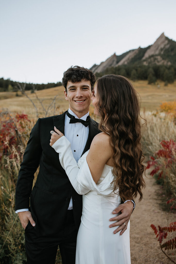 bride kissing the groom on the cheek