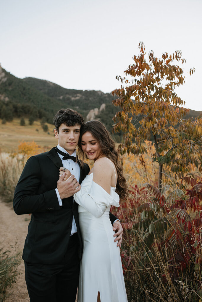 cute couple smiling at the camera during their session 