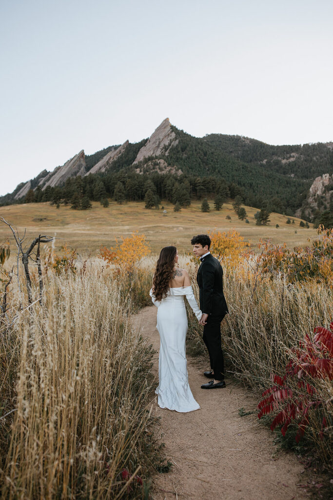 cute couple walking around their elopement location