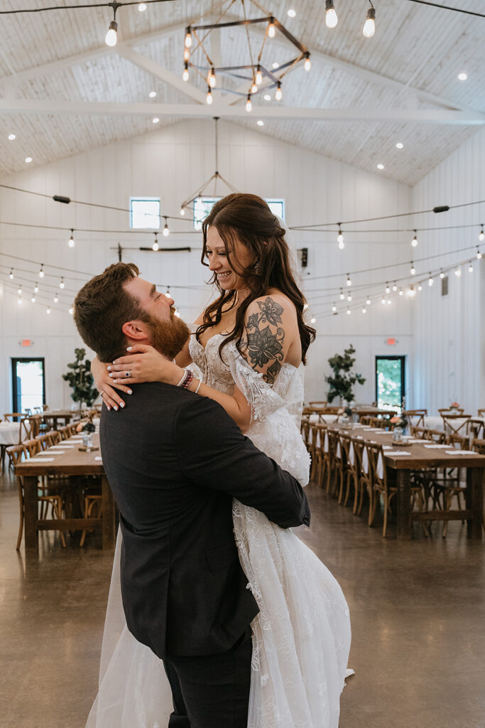 Bride and groom smiling at each other