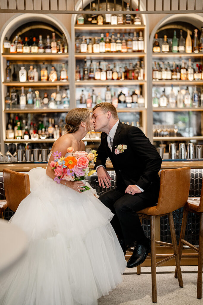 picture of the newlyweds kissing during their photoshoot