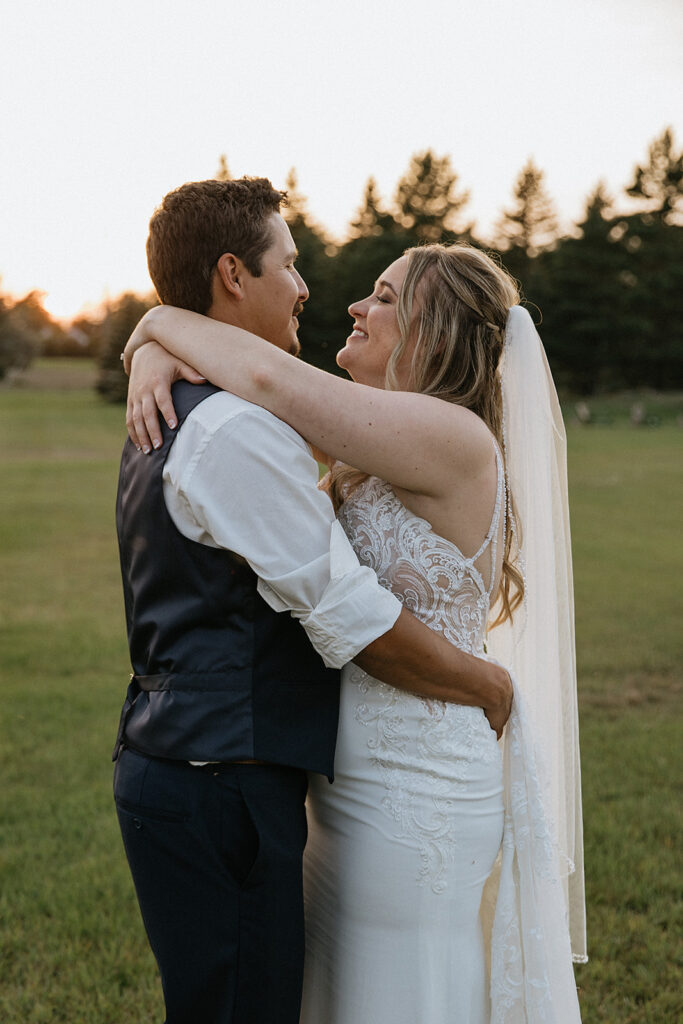 cute picture of the bride and groom hugging