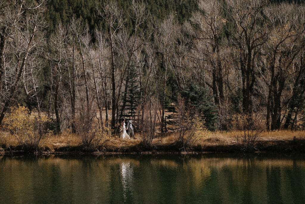 couple walking around their stunning elopement location during their bridal session