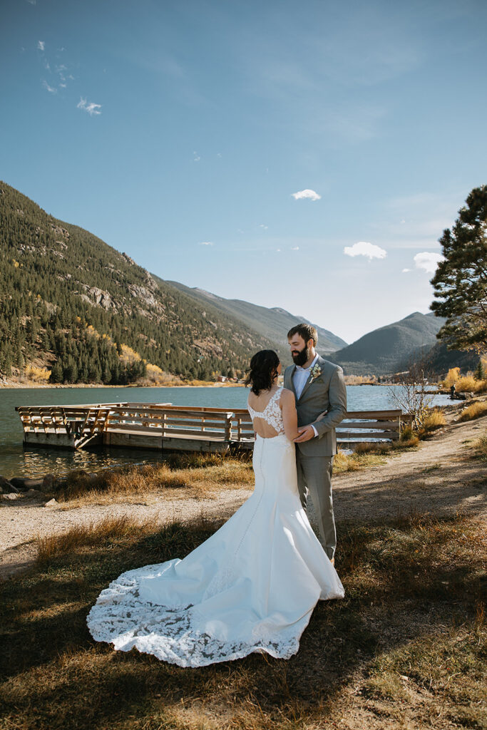Bride and grooms smiling at each other