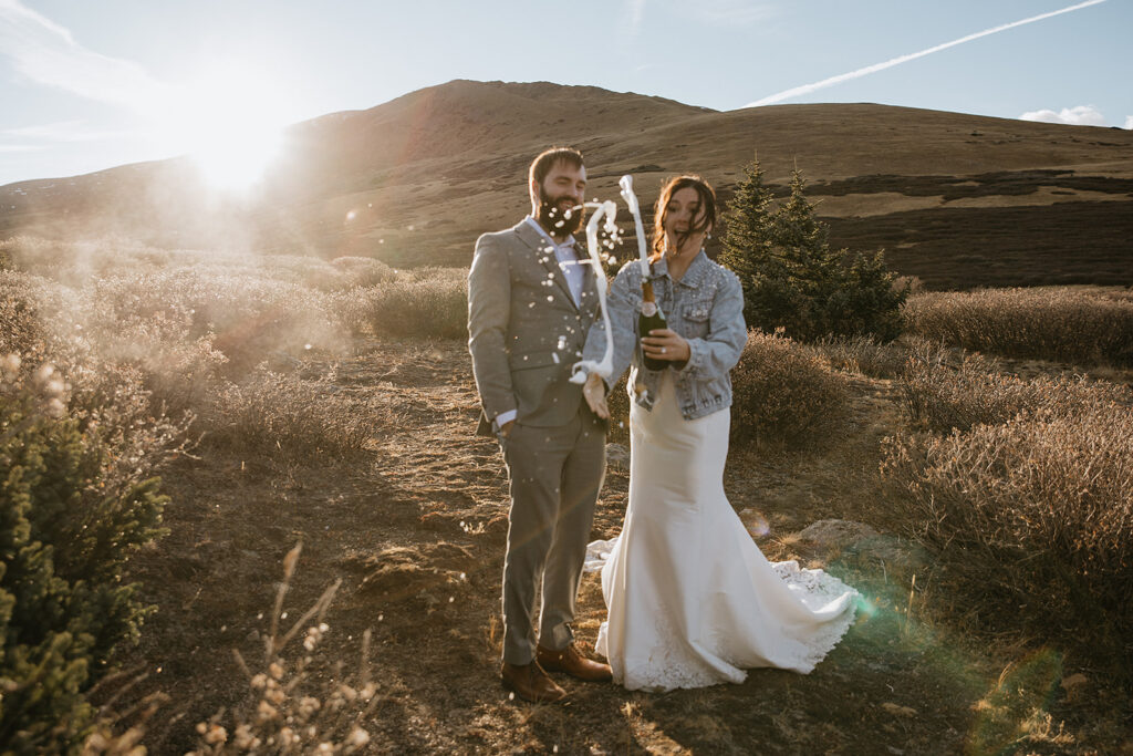 cute couple celebrating their elopement with champagne 