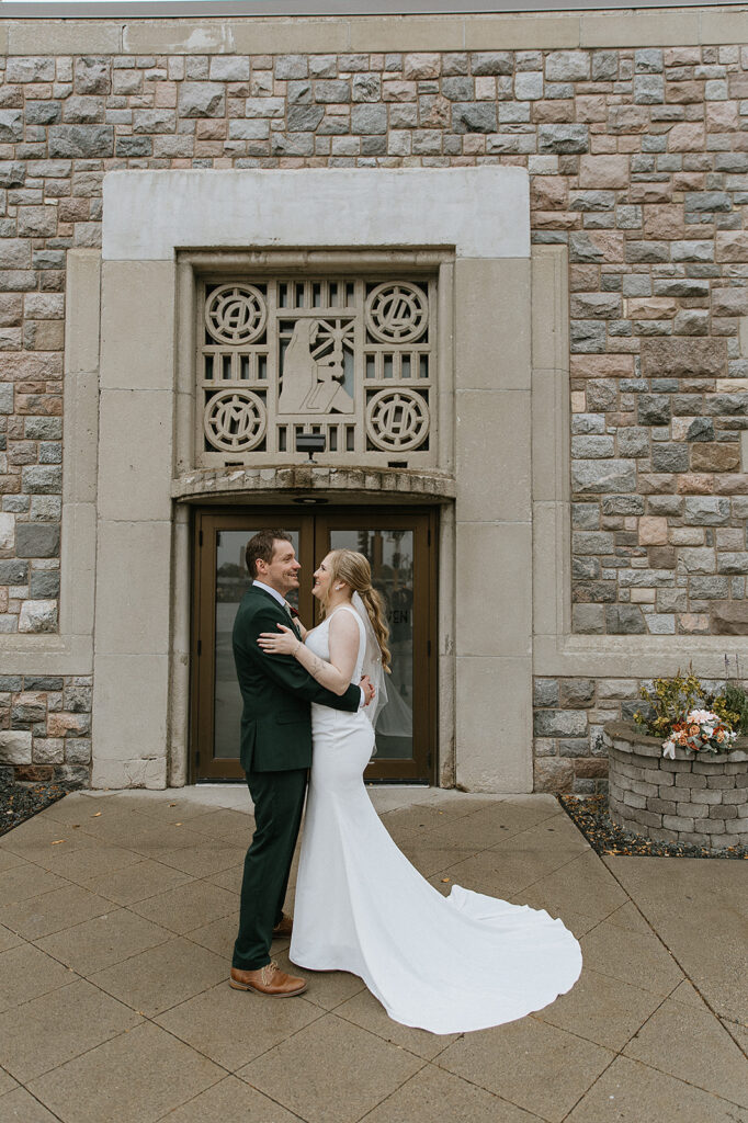 bride and groom laughing with each other