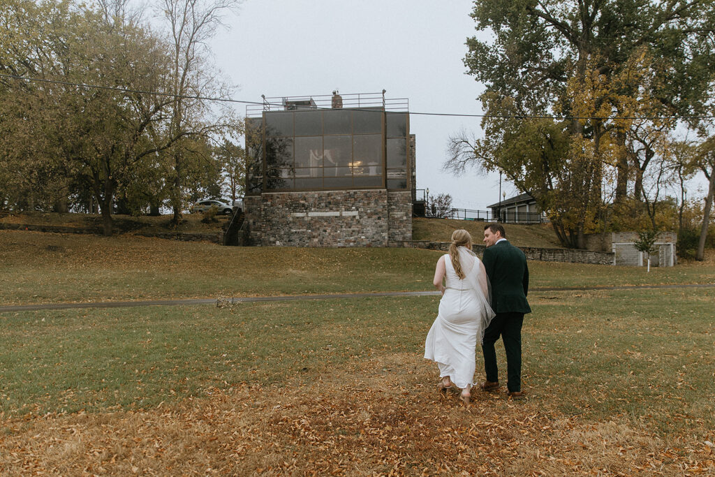 Couple walking around their wedding venue