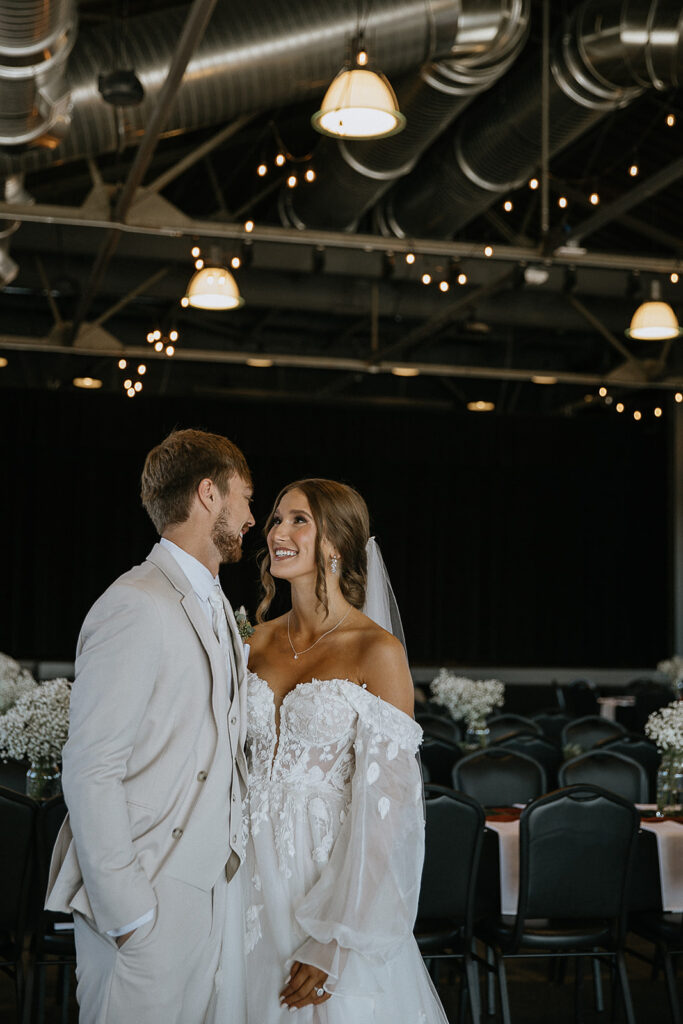 Bride and groom, smiling at each other