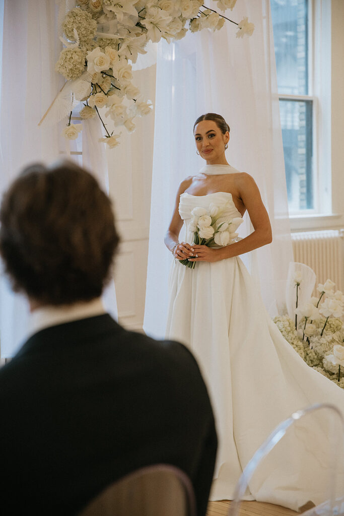 picture of the groom admiring the bride