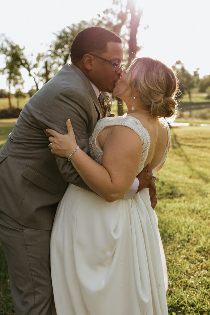 cute picture of the newlyweds kissing during their bridal portraits 