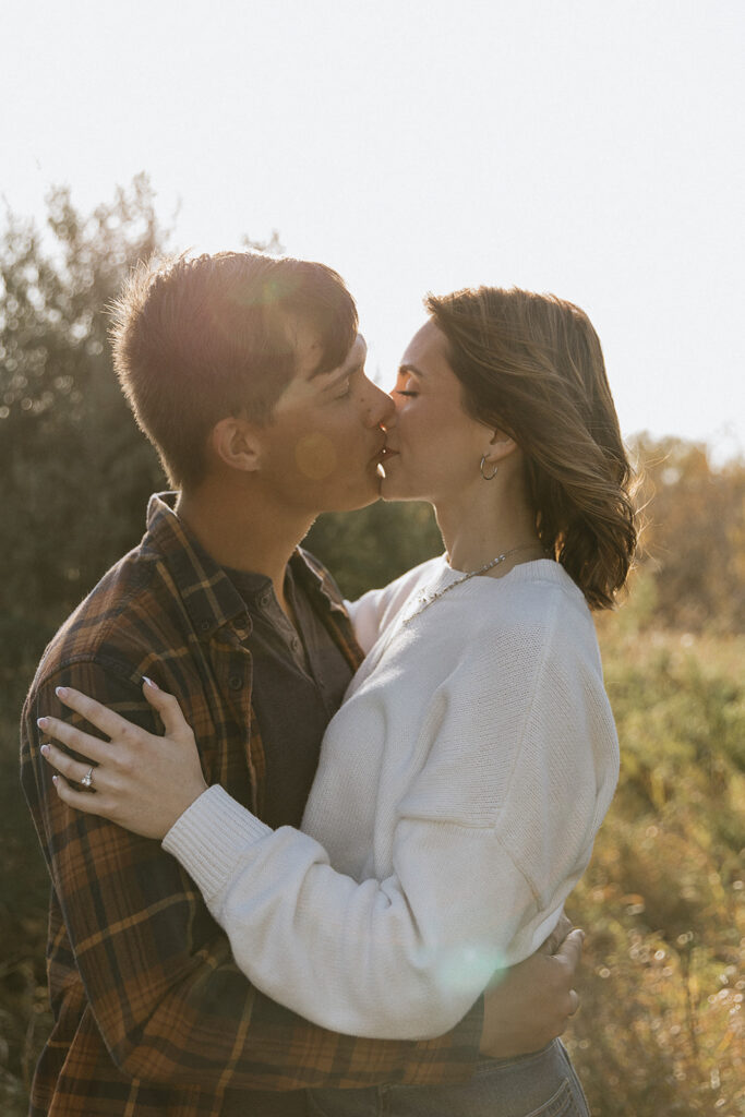 cute couple kissing during their golden hour session