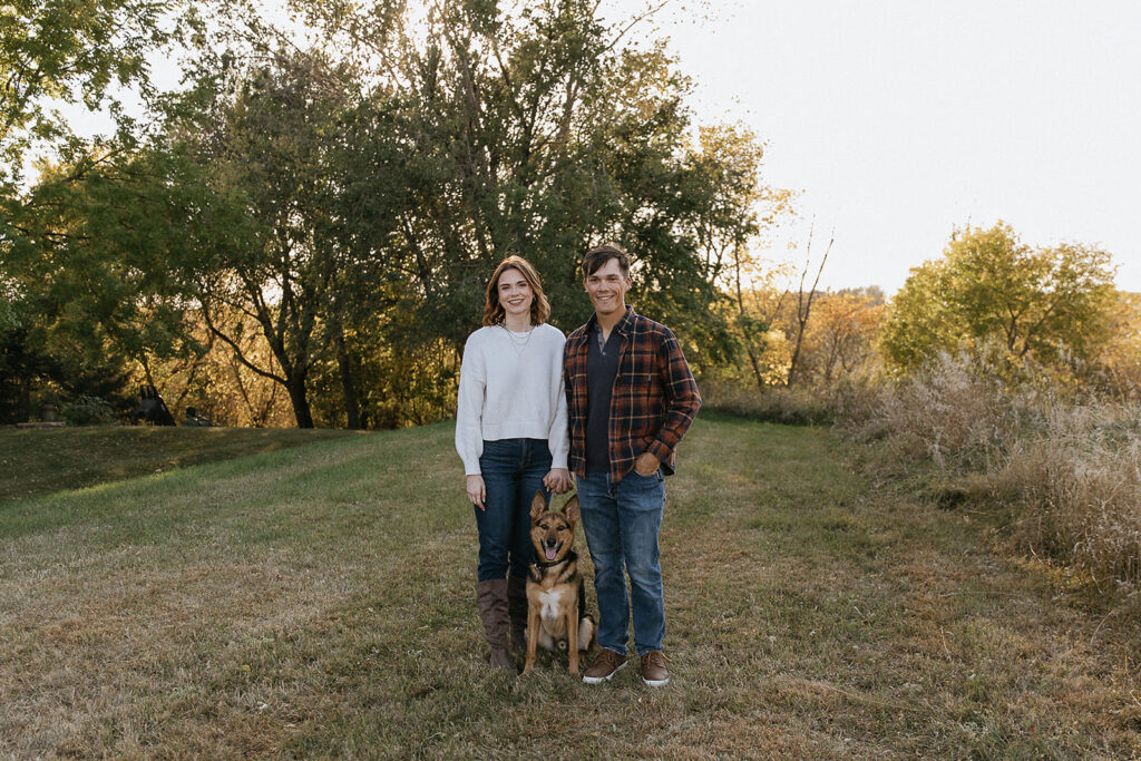 portrait of the newly engaged couple and their dog