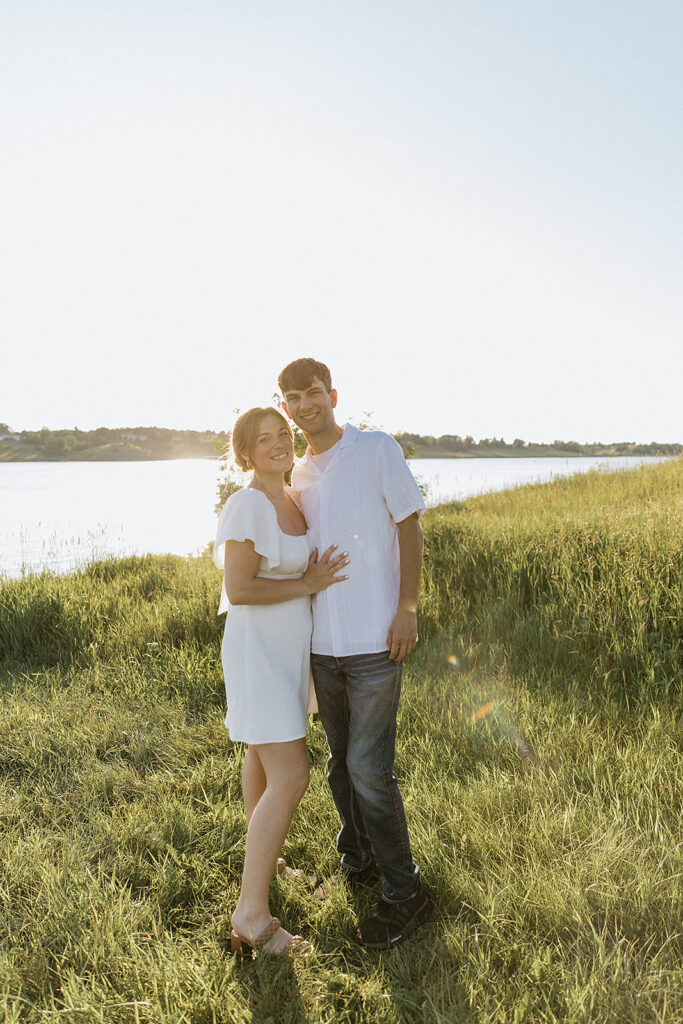 couple smiling at the camera during their session