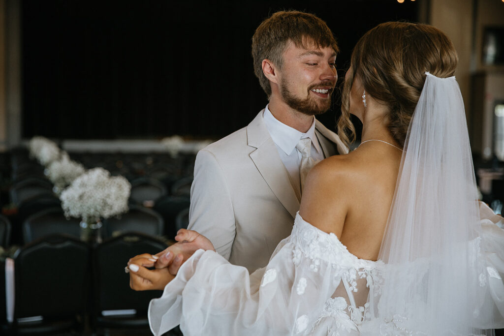 picture of the bride and groom kissing after their first look
