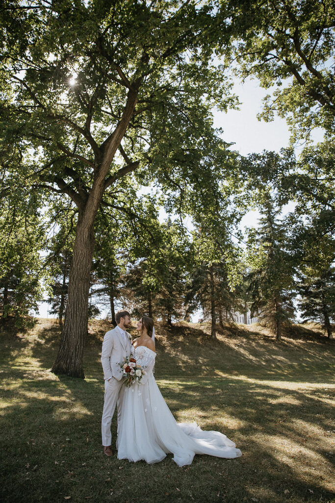 cute picture of the bride and groom smiling at each other