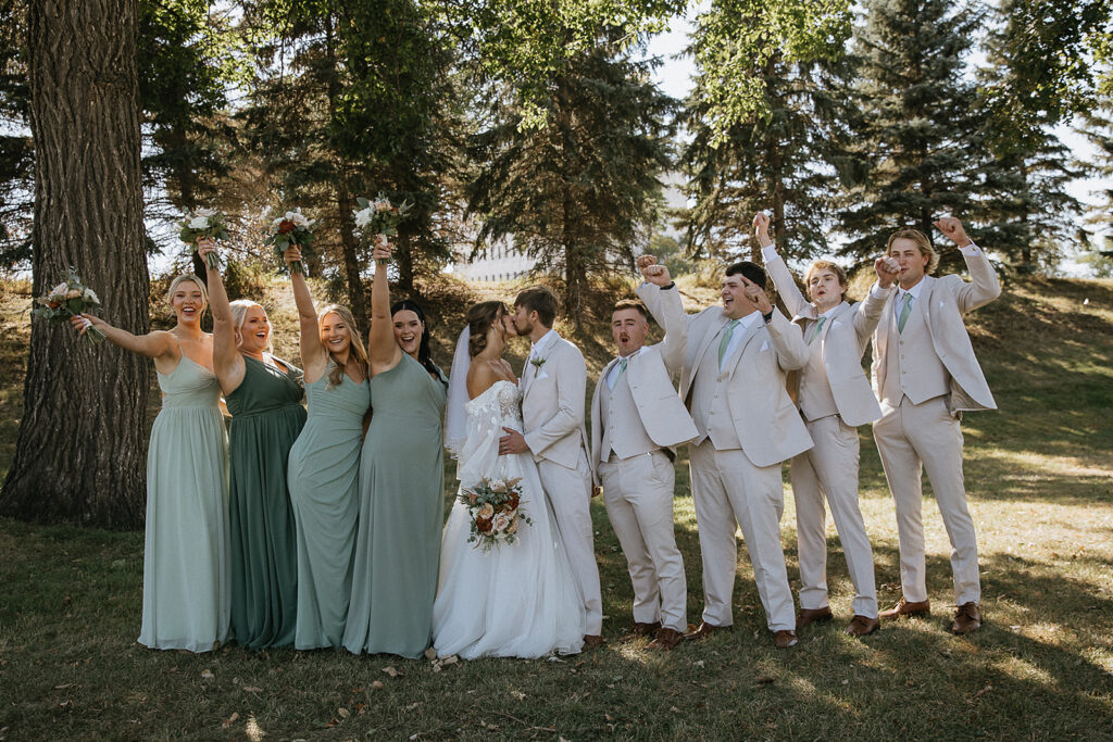 picture of the bride and groom with their bridesmaids and groomsmen 