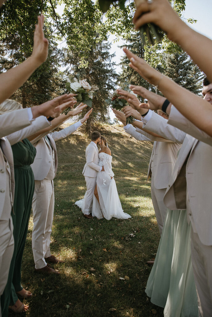 picture of the bride and groom with their friends before the ceremony