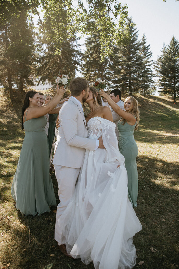 cute picture of the bride and groom kissing