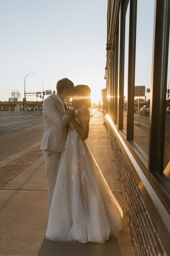 portrait of the newlyweds kissing