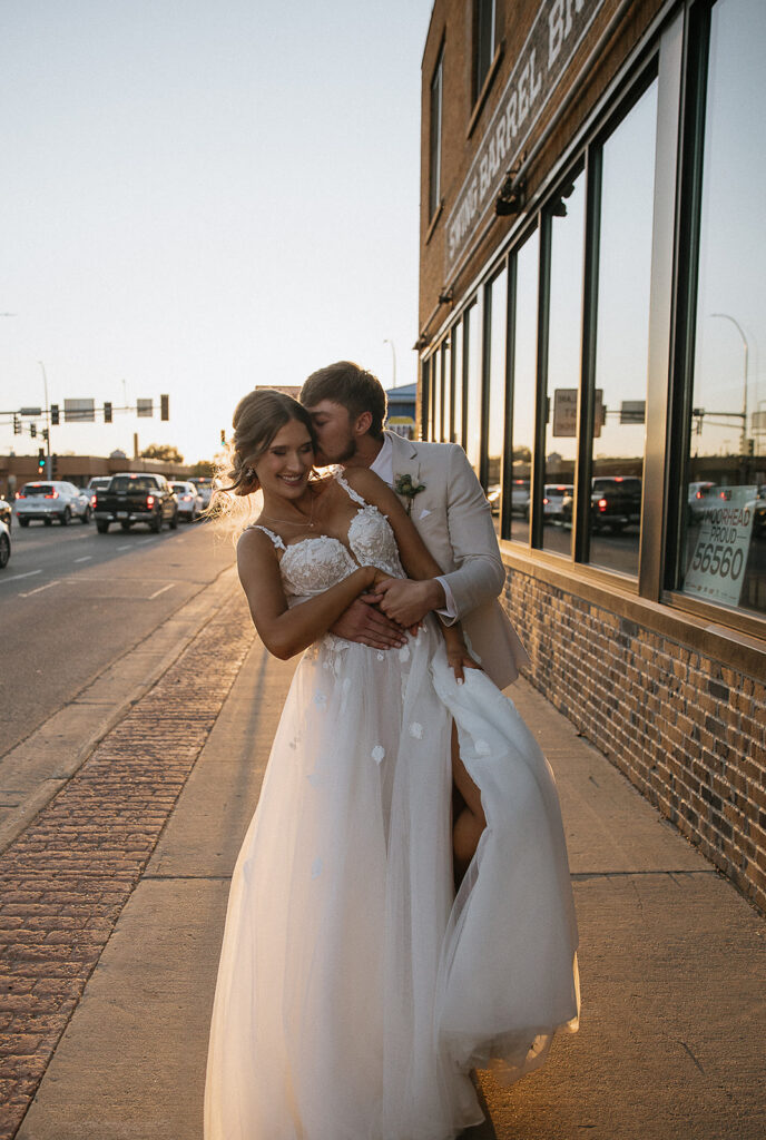 couple laughing with each other during their bridal portraits 