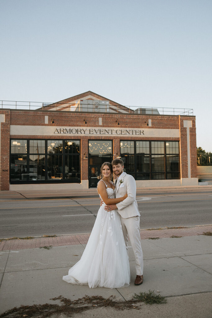 portrait of the newlyweds smiling at the camera