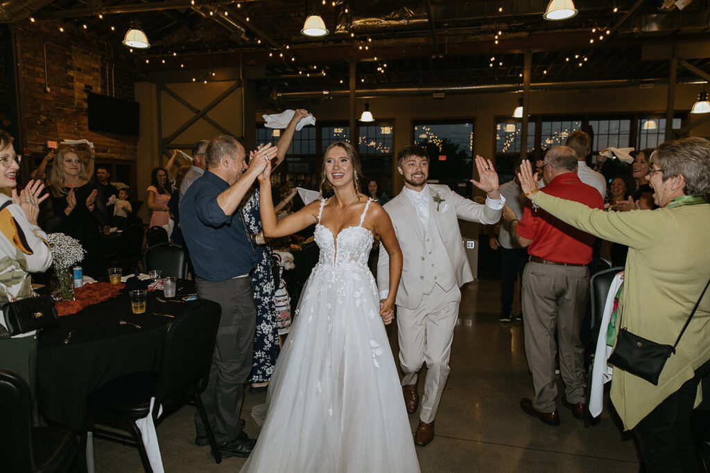 couple arriving at their reception