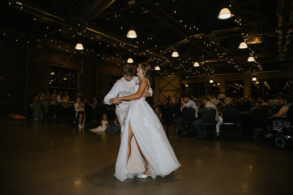 cute couple dancing at their reception party