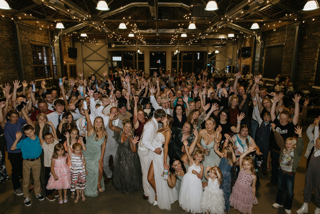 cute picture of the bride and groom with their wedding guests