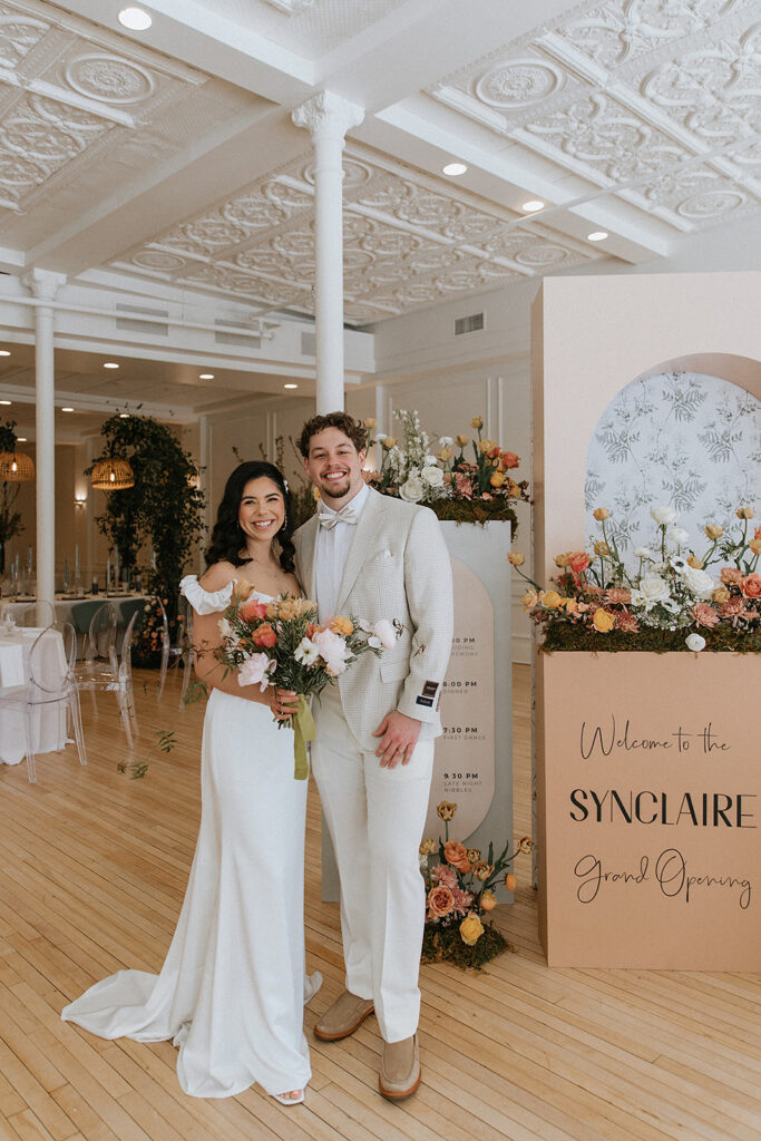 couple smiling at the camera during their dream bridal session