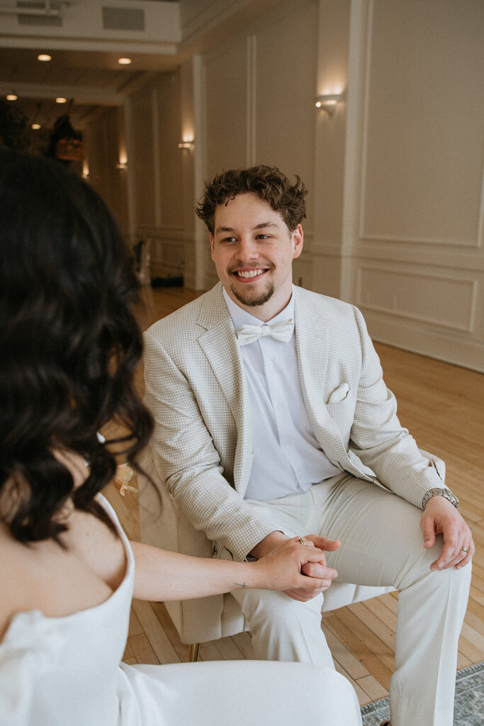 cute picture of the groom smiling at the bride
