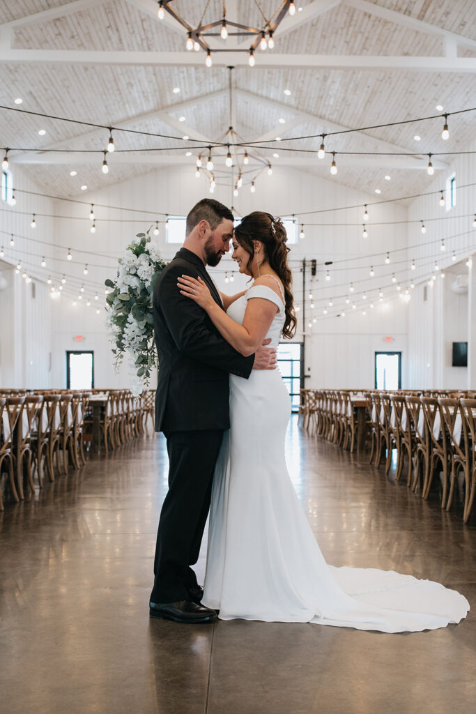 cute picture of the newlyweds smiling at each other
