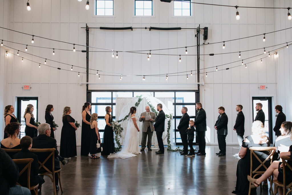 bride and groom holding hands during their wedding ceremony