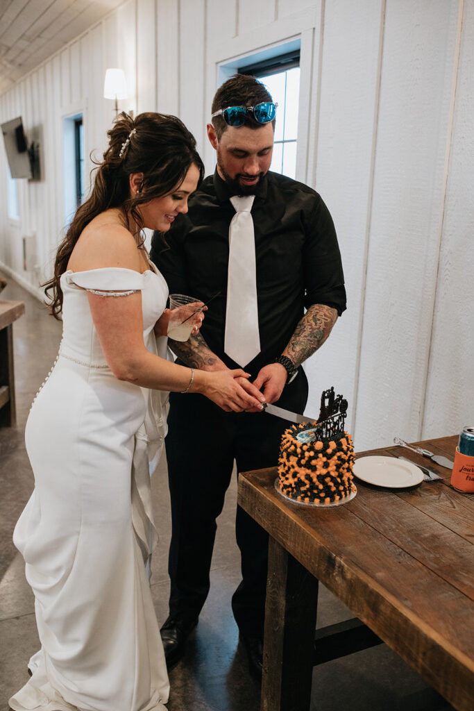 newlyweds cutting their wedding cake