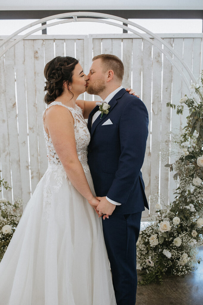 cute picture of the newlyweds kissing