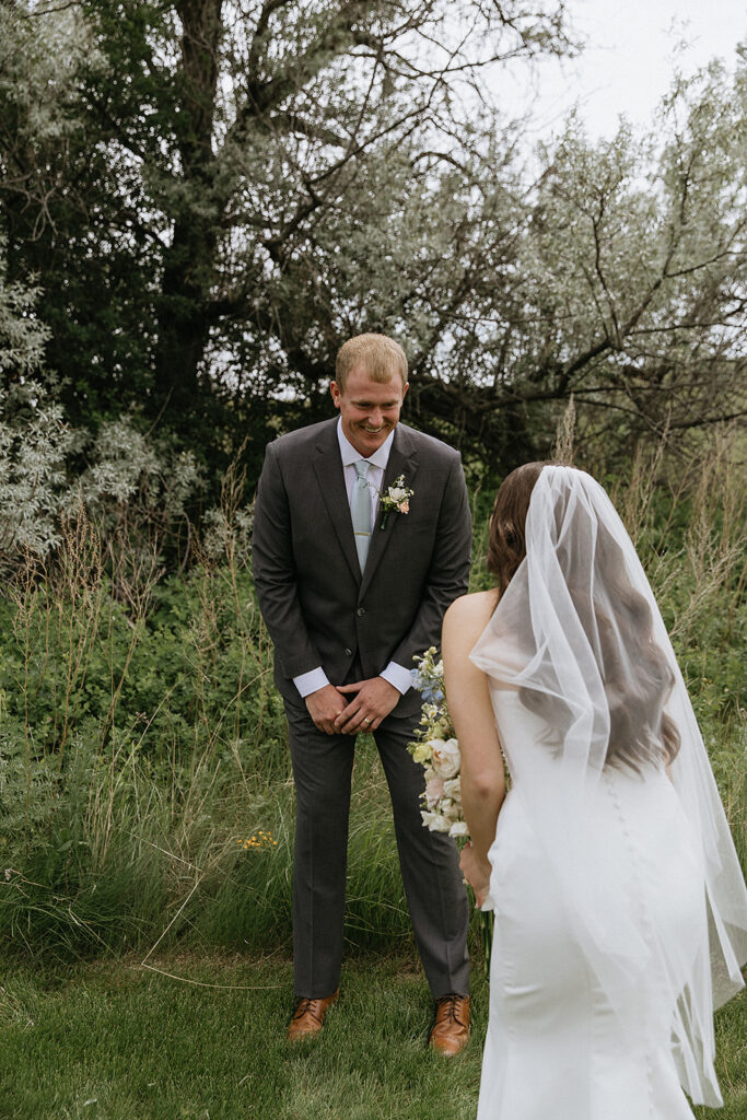 Groom emotional, seeing the bride in her wedding dress