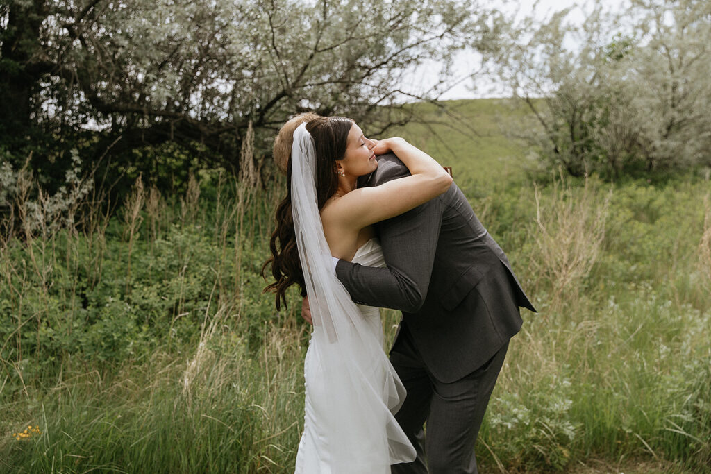 Cute picture of the bride and groom hugging