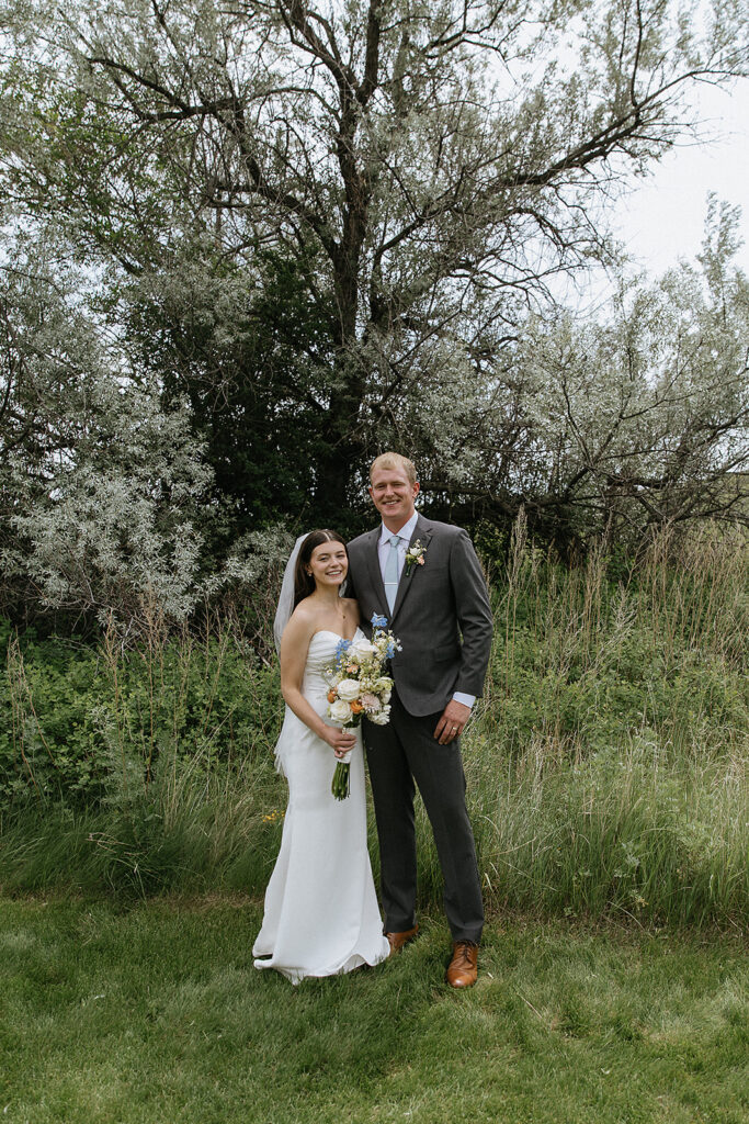 Bride and groom posing for the camera during their bridal portraits