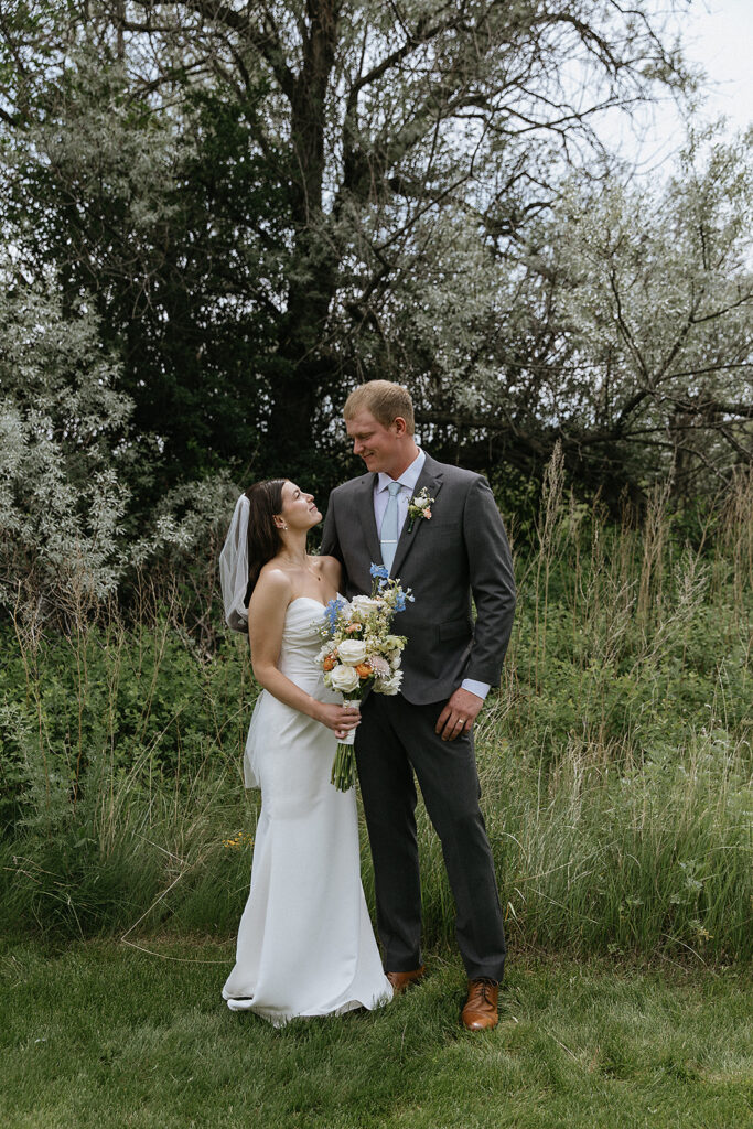 Cute picture of the bride and groom smiling at each other