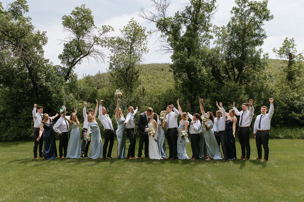 fun picture of the bride and groom with the bridal parties