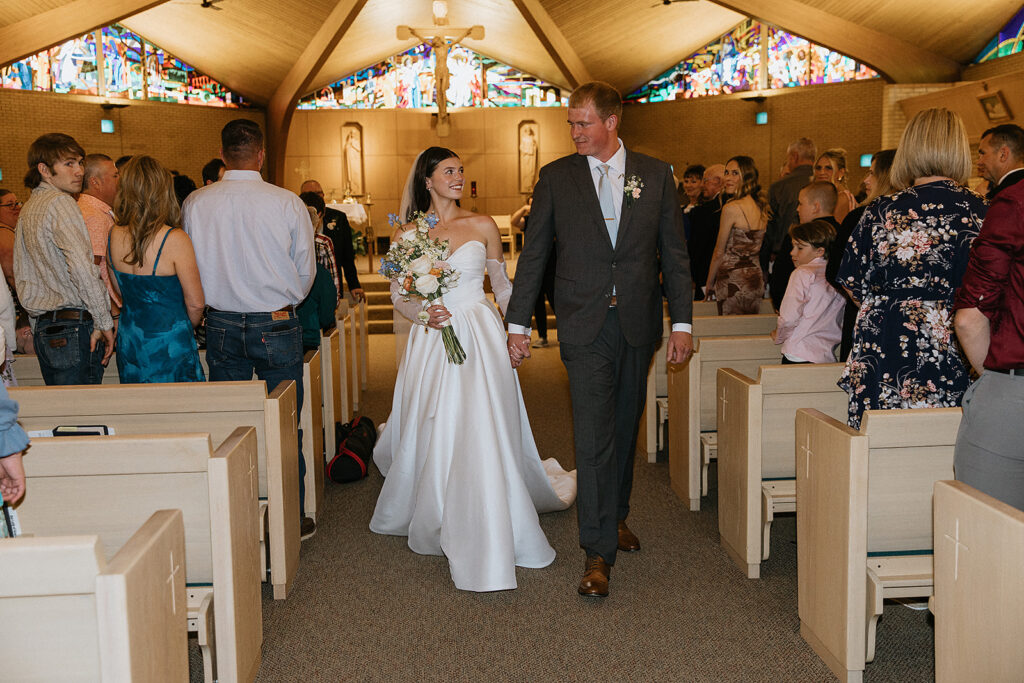 Cute picture of the newlyweds heading to their wedding reception