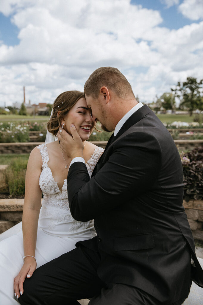 bride and groom laughing with each other