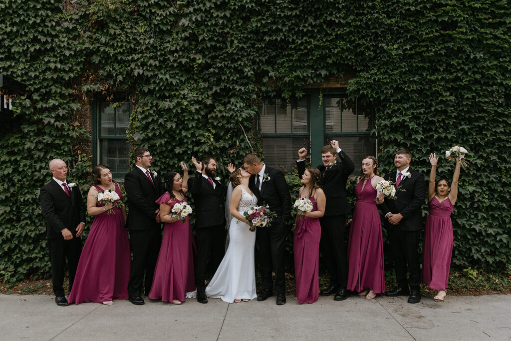 Picture of the bride and groom with their bridesmaids and groomsmen