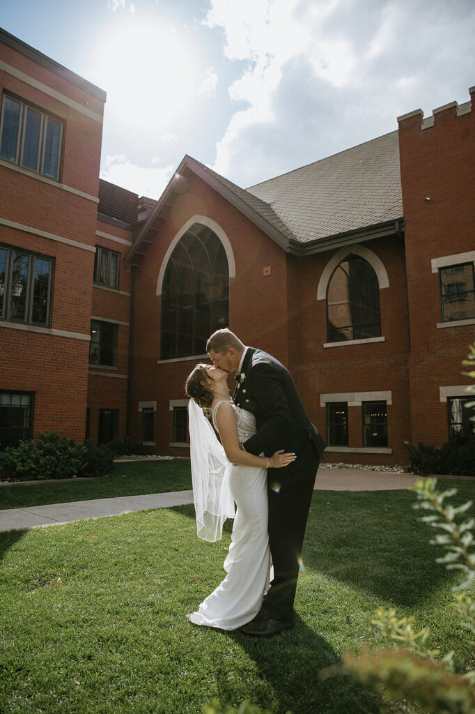 Picture of the bride room, kissing during golden hour
