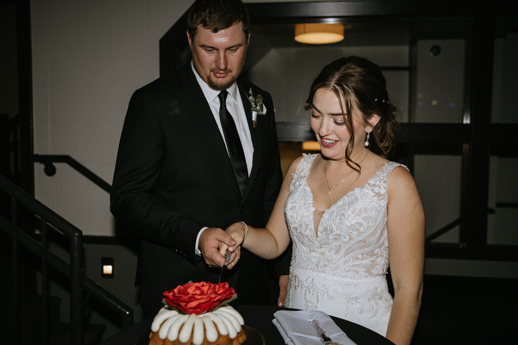 Cute picture of the newly married couple cutting their wedding cake