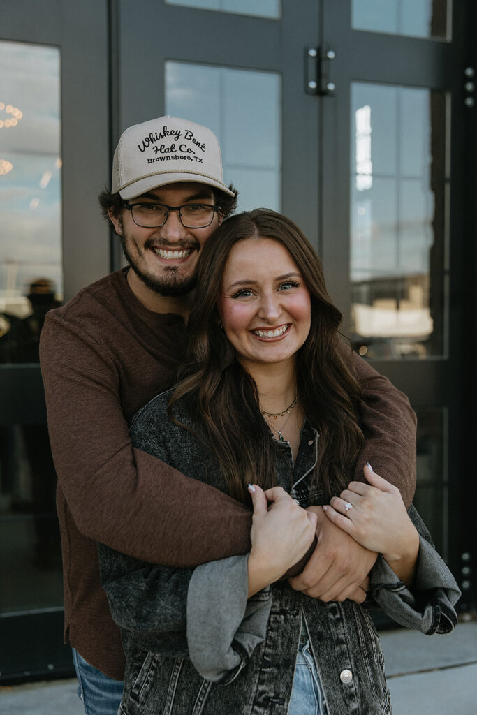 cute picture of the newly engaged couple hugging