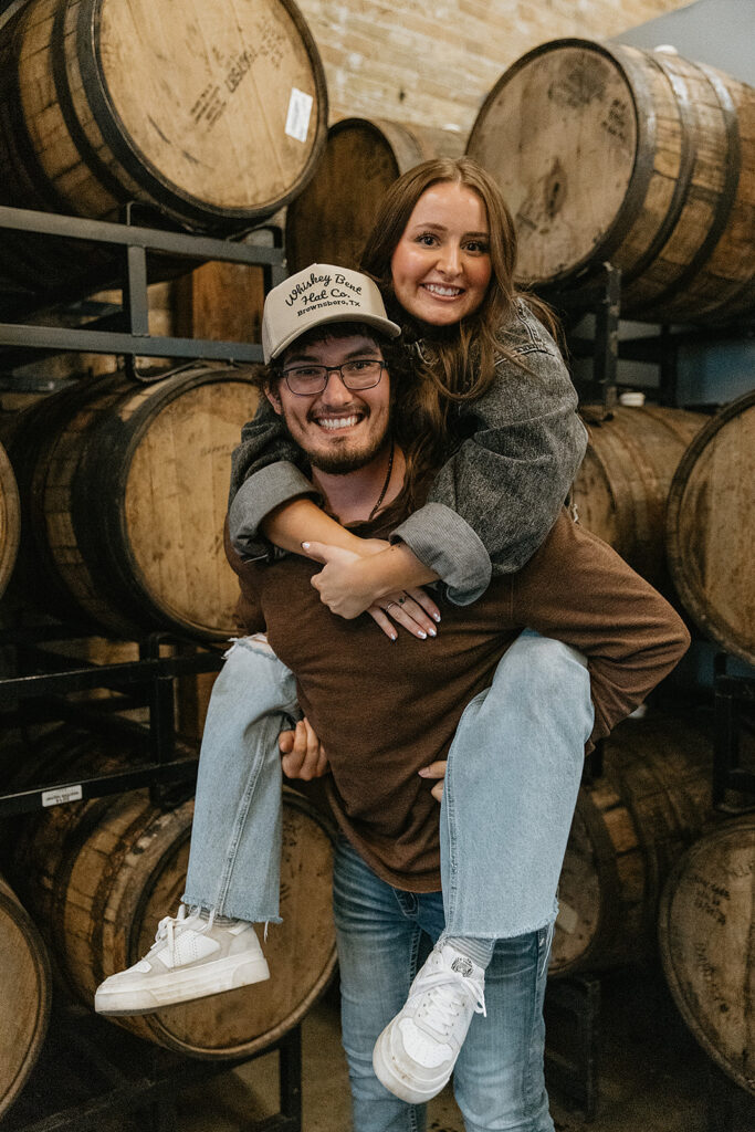 couple smiling at the camera during their photoshoot
