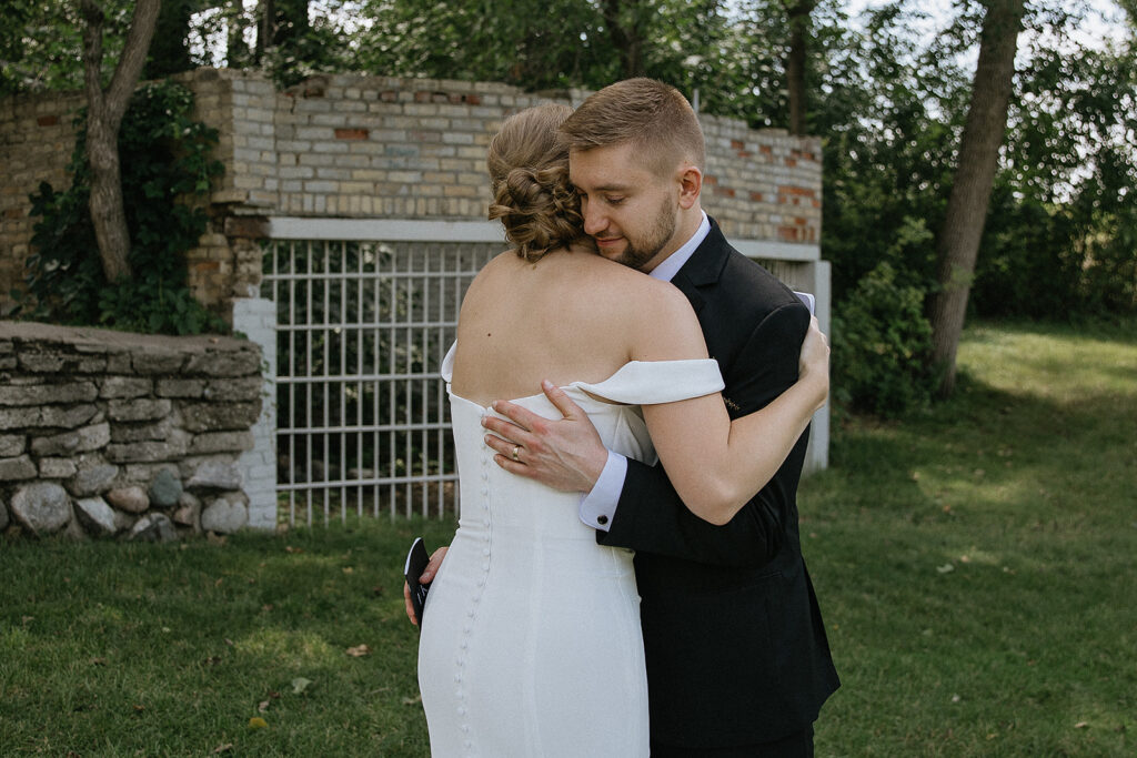 couple hugging after reading their vows