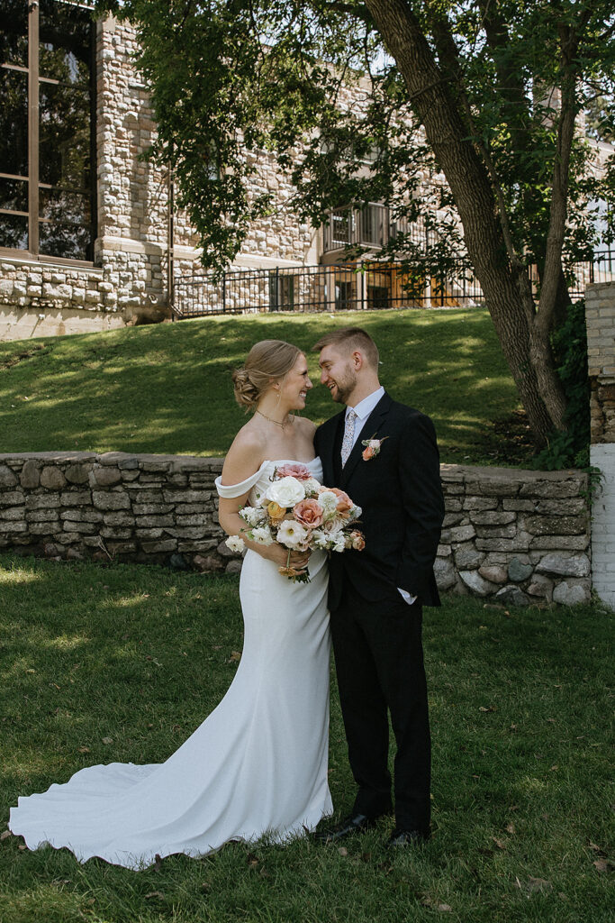picture of the bride and groom smiling to each other